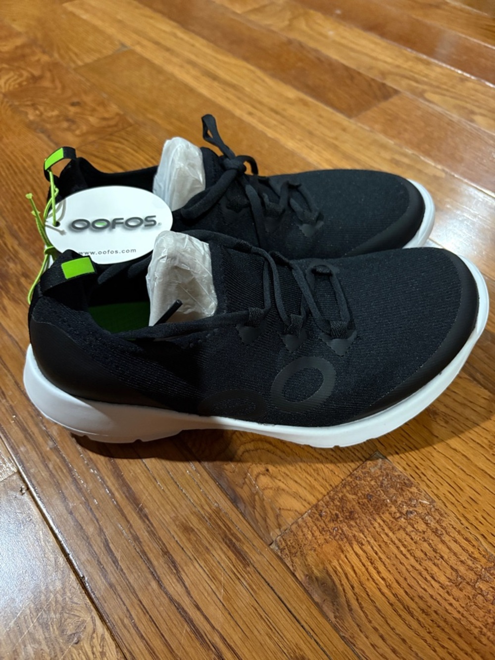 OOFOS Black Slip-On Knit Sneakers with Neon Green Sole and Neon Green Accents
